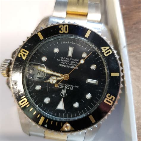 gold and silver submariner